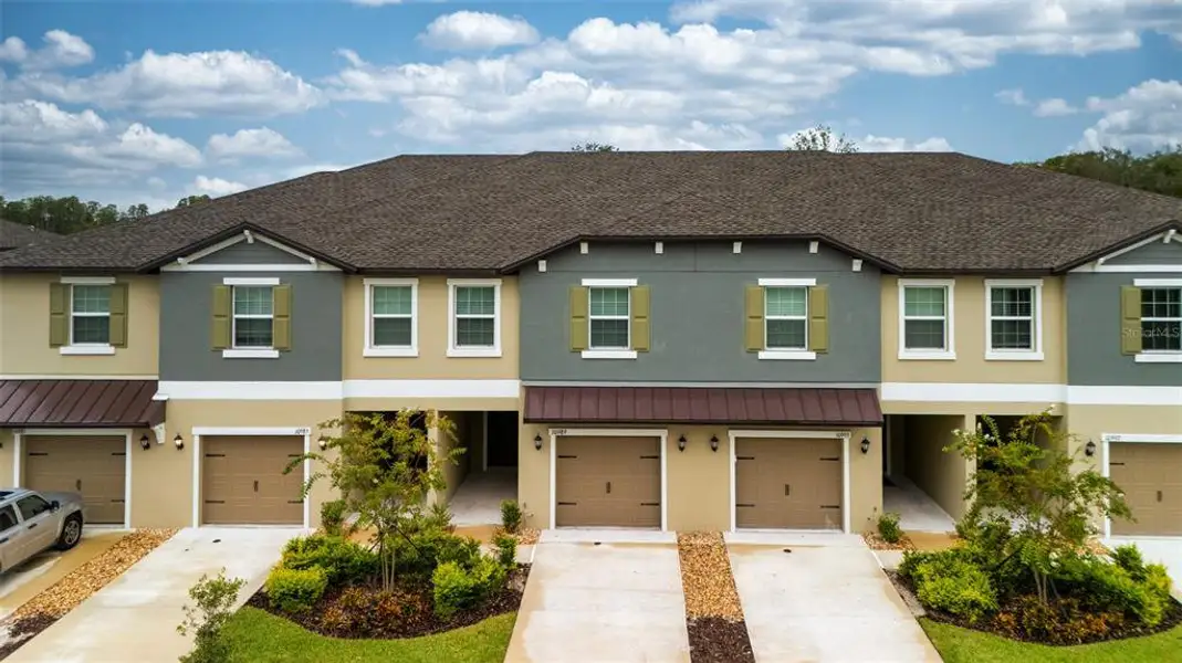 Front exterior of a new home in , Land O' Lakes, FL, highlighting curb appeal (Image 1). Front exterior of a new home in , Land O' Lakes, FL, highlighting curb appeal (Image 1).