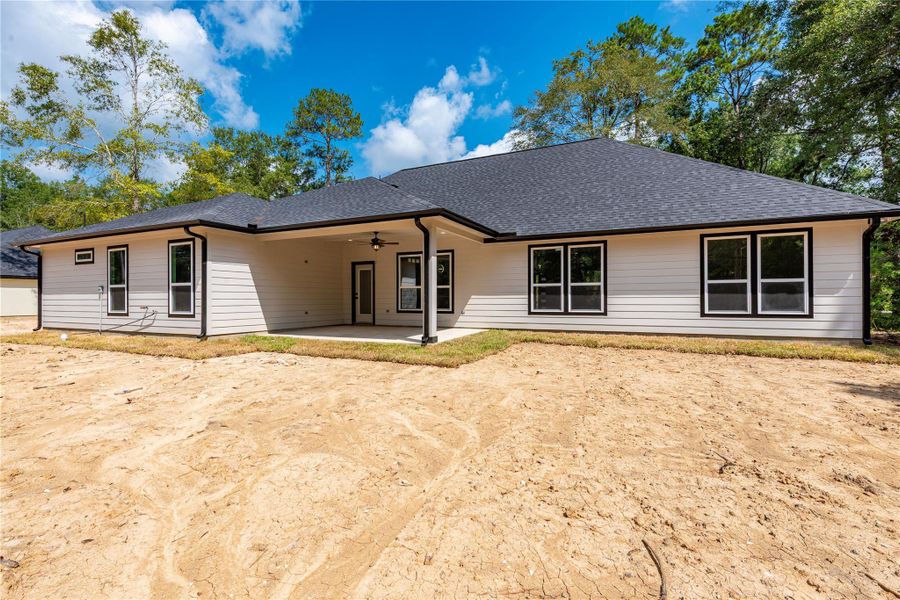 Front exterior of a new home in , Dayton, TX, highlighting curb appeal (Image 1).