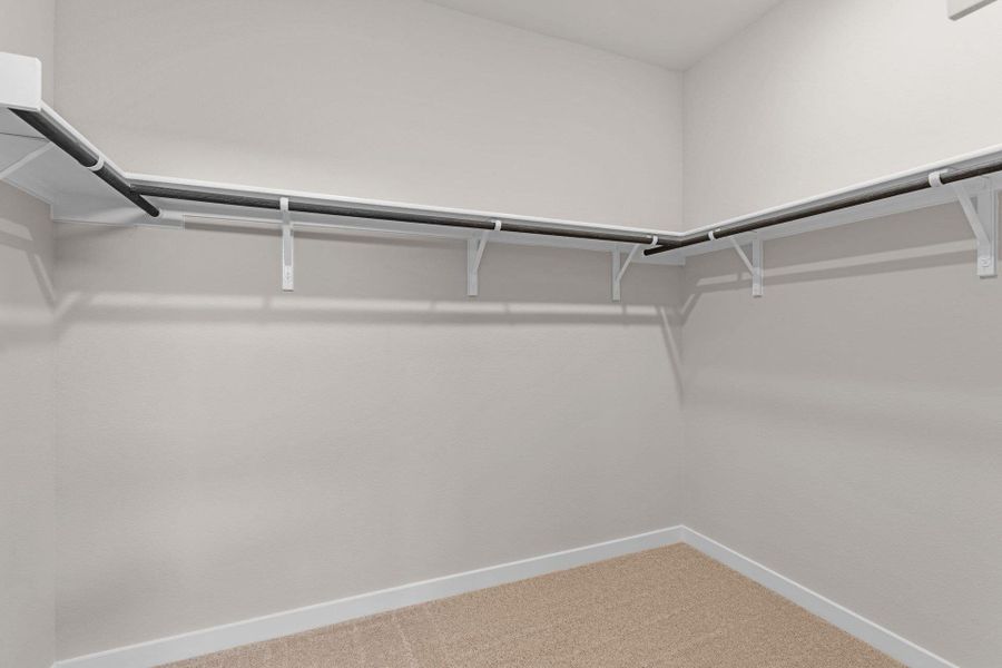 Walk-in closet in Primary Bedroom Walk-in closet in Primary Bedroom