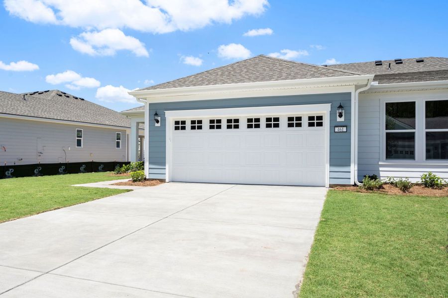 Front exterior of a new home in Sun City Hilton Head, Bluffton, SC, highlighting curb appeal (Image 1). Front exterior of a new home in Sun City Hilton Head, Bluffton, SC, highlighting curb appeal (Image 1).