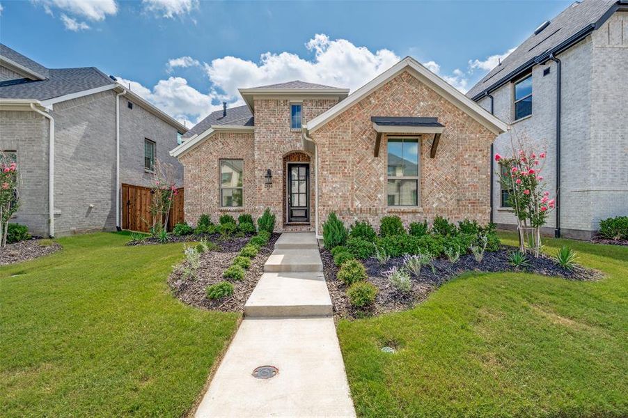 Front exterior of a new home in Cambridge Crossing, Celina, TX, highlighting curb appeal (Image 1). Front exterior of a new home in Cambridge Crossing, Celina, TX, highlighting curb appeal (Image 1).