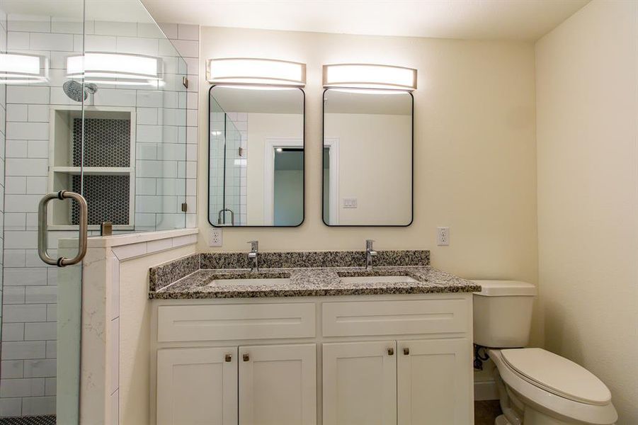 Full bath with a shower stall and double vanity Full bath with a shower stall and double vanity