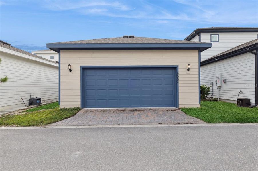 Exterior details and patio area of a home in Weslyn Park at Sunbridge (Craft Homes), St. Cloud (Image 4).