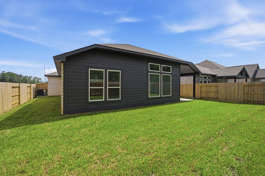 Exterior details and patio area of a home in Sundance Cove, Crosby (Image 28).