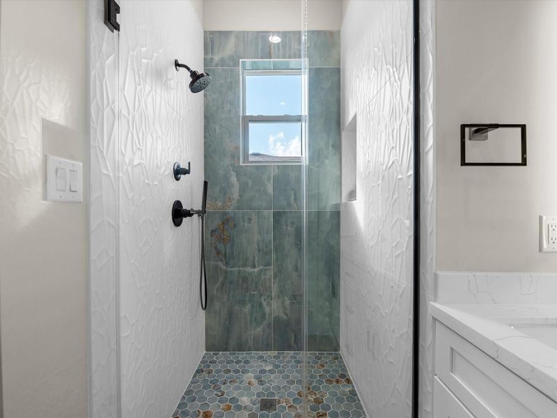 Look at the beautiful detail and color in the walk-in shower Look at the beautiful detail and color in the walk-in shower