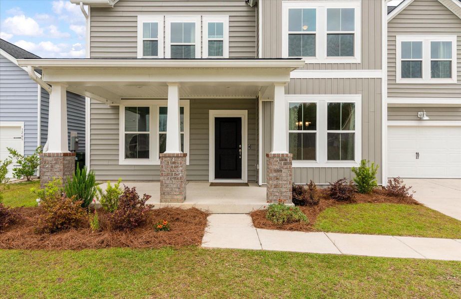 Exterior details and patio area of a home in Sweetgrass at Summers Corner, Summerville (Image 32).