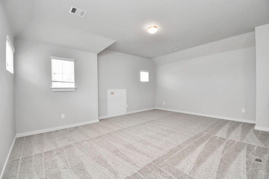 Another view of open game room area. Sample photo of completed home with similar floor plan. Actual colors and selections may vary.