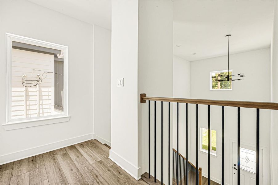 Elegant staircase with modern railing leading to the second floor. Elegant staircase with modern railing leading to the second floor.