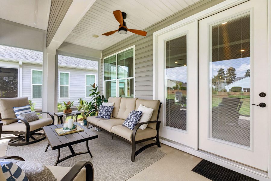 Exterior details and patio area of a home in K. Hovnanian's® Four Seasons at Lakes of Cane Bay, Summerville (Image 23).