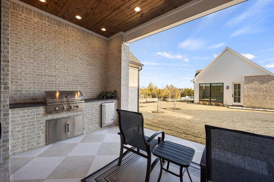 Summer kitchen and covered patio overlook cabana