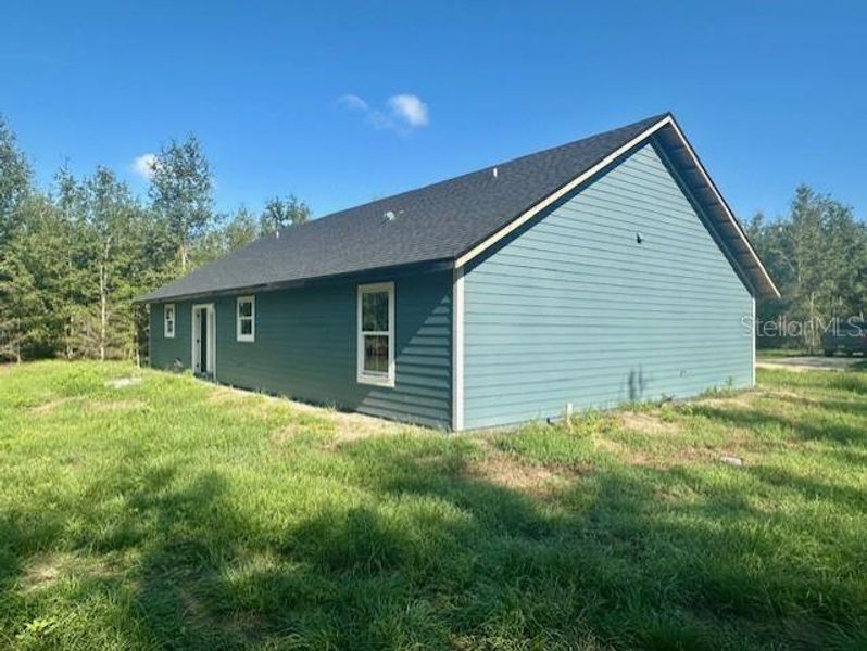 Front exterior of a new home in , Bell, FL, highlighting curb appeal (Image 7). Front exterior of a new home in , Bell, FL, highlighting curb appeal (Image 7).