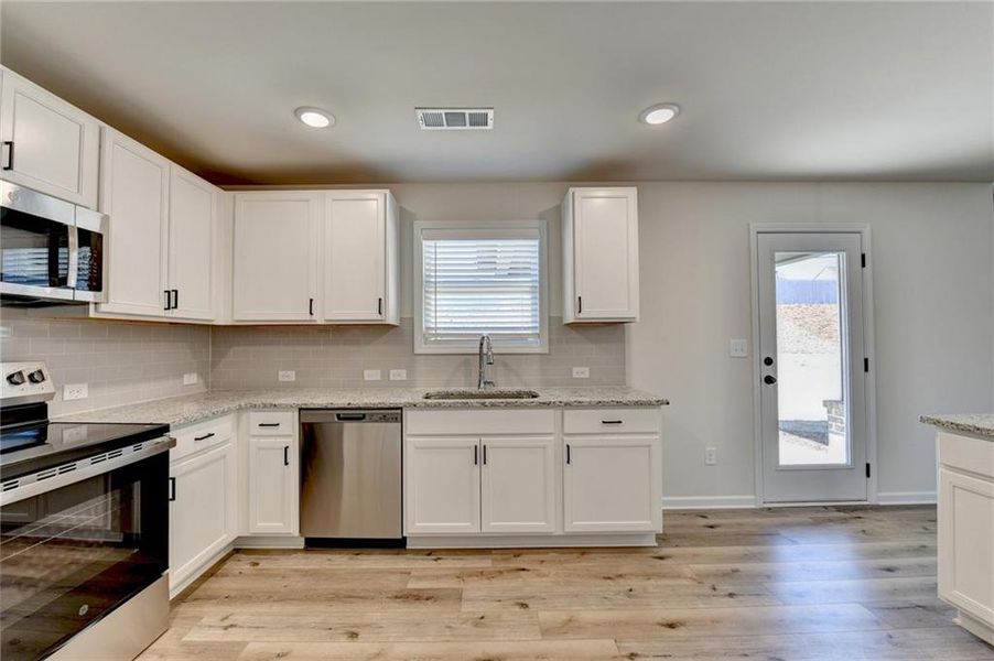 Furnished interior view inside a new home in , Auburn (Image 7).