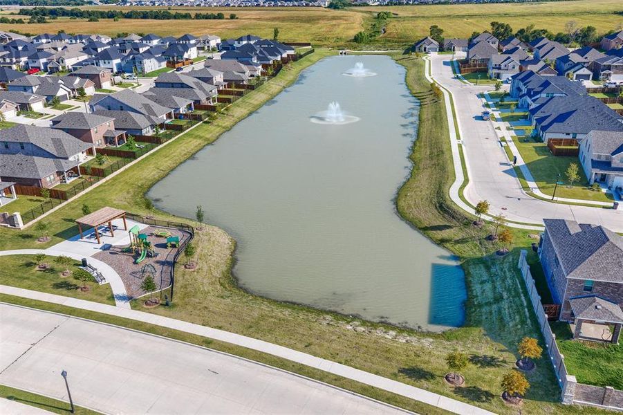 Aerial view of residential area with a nearby body of water Aerial view of residential area with a nearby body of water
