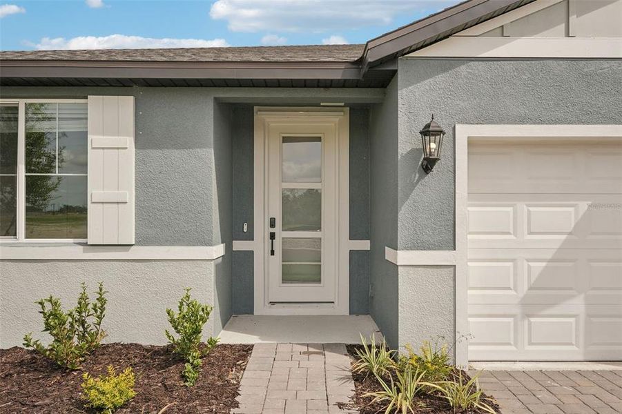 Exterior details and patio area of a home in Oakfield Trails - Signature Series, Parrish (Image 3).