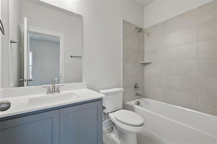 Bathroom with vanity and shower / bathtub combination