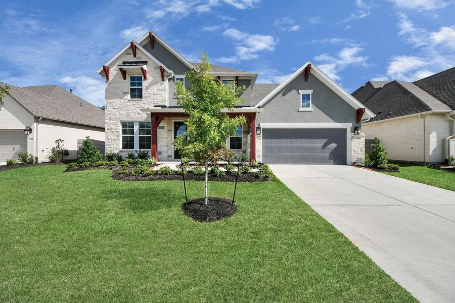 Front exterior of a new home in ARTAVIA: Hilltop Collection, Conroe, TX, highlighting curb appeal (Image 2). Front exterior of a new home in ARTAVIA: Hilltop Collection, Conroe, TX, highlighting curb appeal (Image 2).