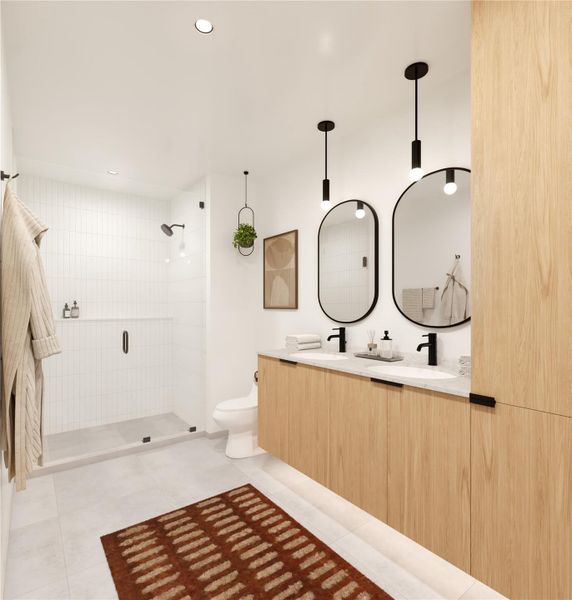 The primary bath in the Shady Grove palette features warm cabinetry, black hardware, quartz countertops, and a glass enclosed shower for a clean, modern look.