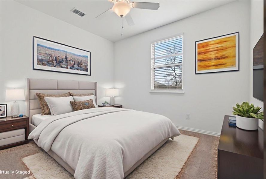 Carpeted bedroom with baseboards and a ceiling fan