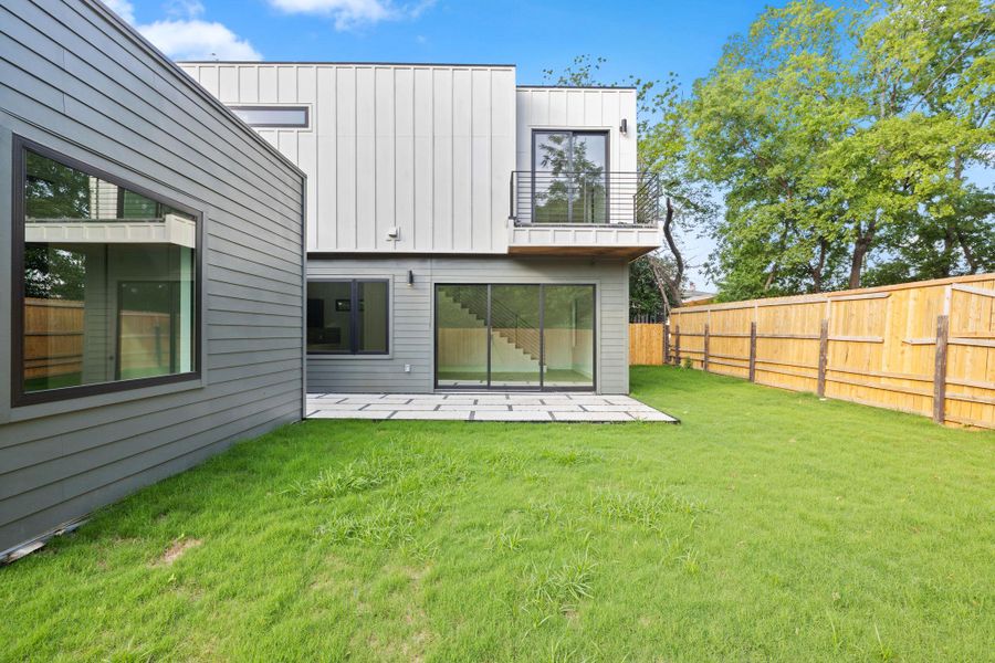 Yard and balcony off primary bedroom