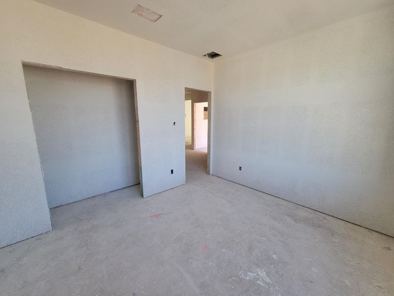 Unfurnished bedroom featuring unfinished concrete flooring Unfurnished bedroom featuring unfinished concrete flooring