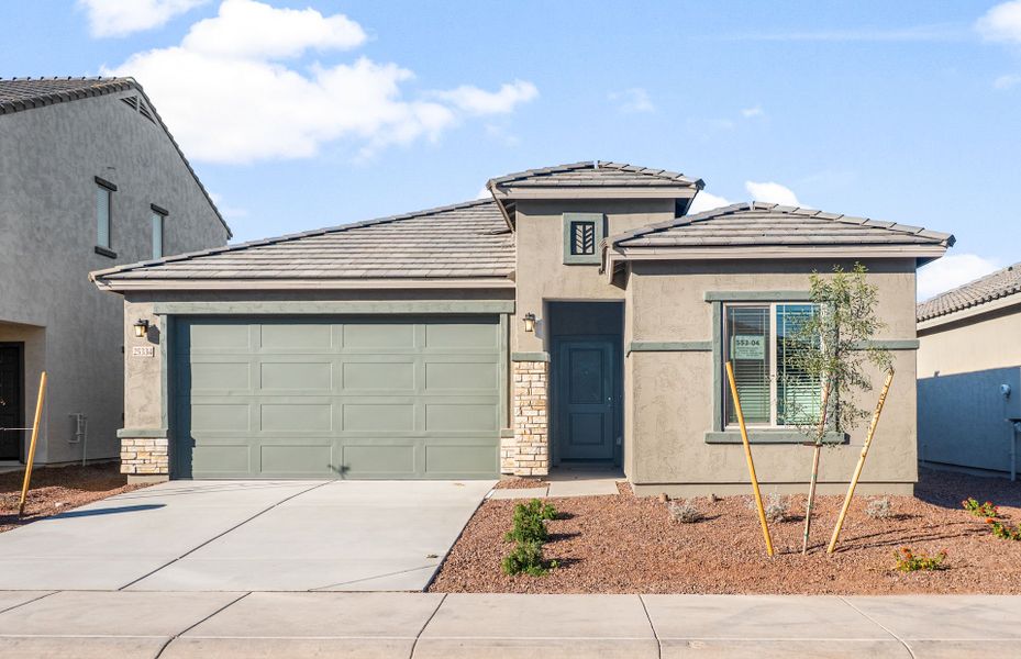 Front exterior of a new home in Copper Falls, Buckeye, AZ, highlighting curb appeal (Image 14). Front exterior of a new home in Copper Falls, Buckeye, AZ, highlighting curb appeal (Image 14).