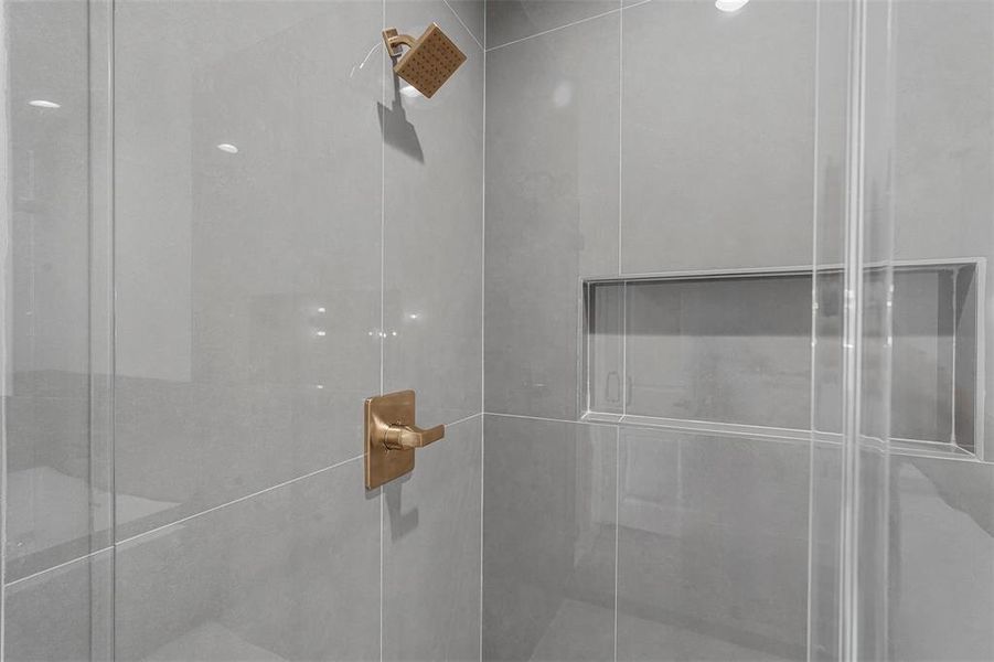 Bathroom featuring a shower stall Bathroom featuring a shower stall