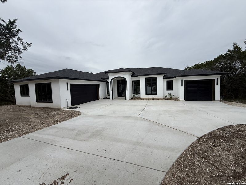 Front exterior of a new home in , Spring Branch, TX, highlighting curb appeal (Image 29).