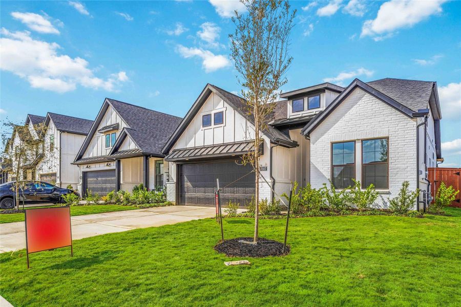 Front exterior of a new home in Elyson, Katy, TX, highlighting curb appeal (Image 1). Front exterior of a new home in Elyson, Katy, TX, highlighting curb appeal (Image 1).