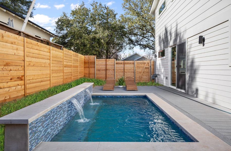 View of pool featuring a fenced backyard and a fenced in pool