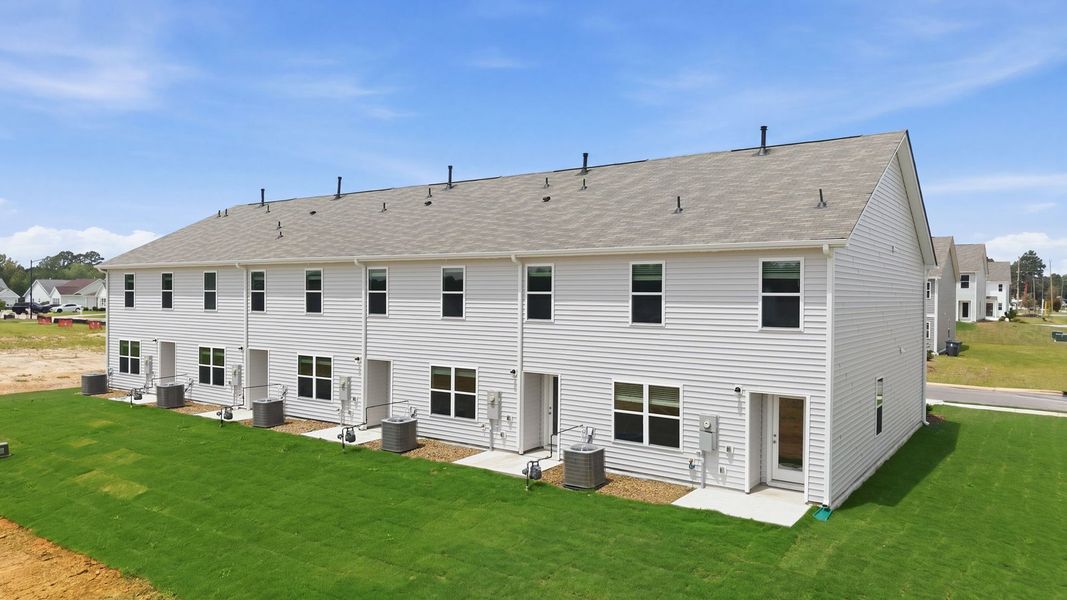 Exterior details and patio area of a home in The Townes at Hunter Hill, Rocky Mount (Image 4).