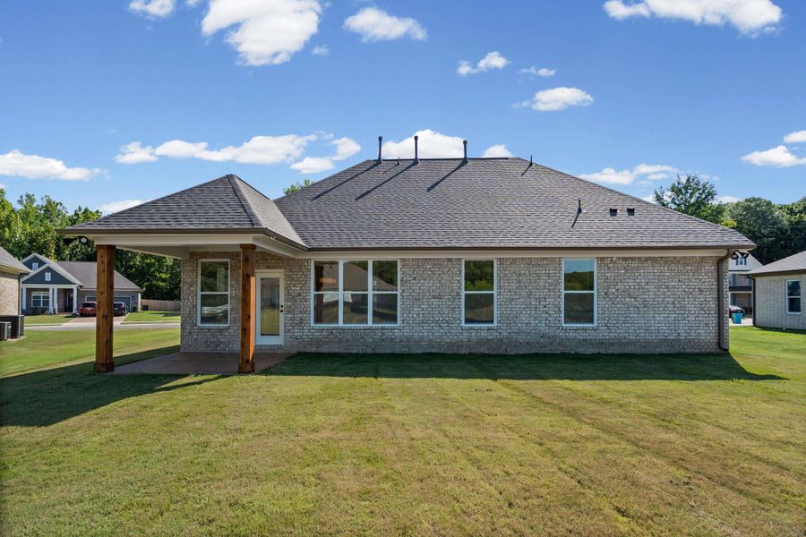 Exterior details and patio area of a home in Villages of Green Meadows, Munford (Image 3).