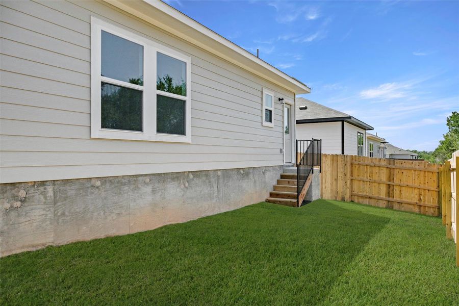 Front exterior of a new home in Cloverleaf, Austin, TX, highlighting curb appeal (Image 19).