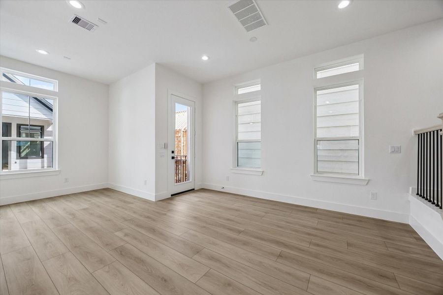 Light-filled living space with neutral finishes and versatile furniture placement Light-filled living space with neutral finishes and versatile furniture placement