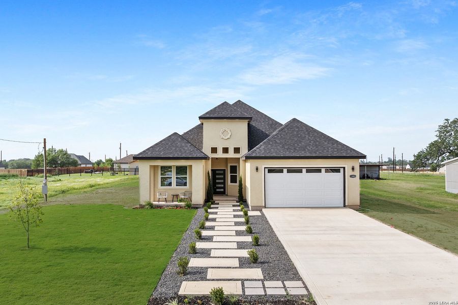 Front exterior of a new home in , Atascosa, TX, highlighting curb appeal (Image 31).