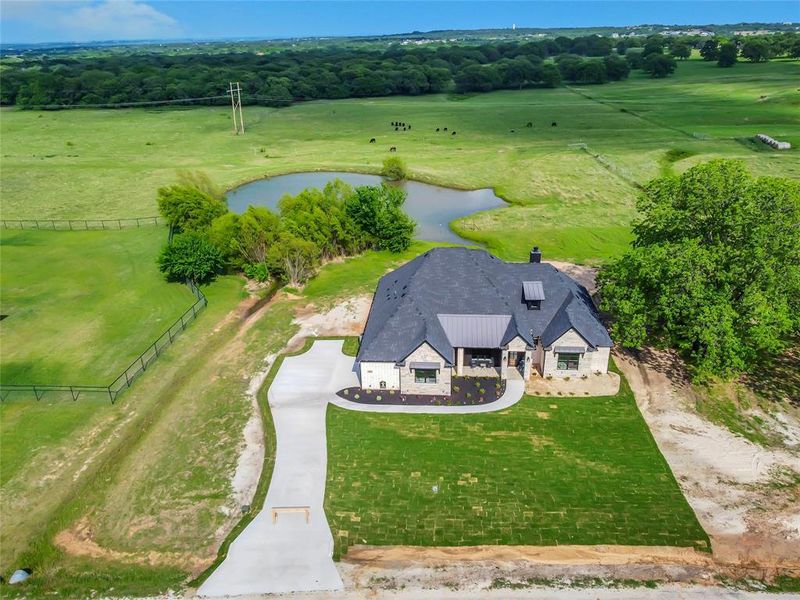 Front exterior of a new home in , Springtown, TX, highlighting curb appeal (Image 27).