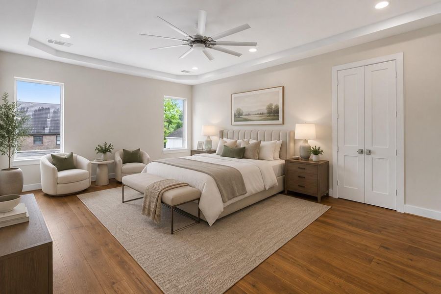 This expansive primary suite offers a true retreat, featuring generous proportions, warm hardwood floors, and a sitting area that’s perfect for morning coffee or evening relaxation.  The perfect sanctuary after a long day.  Virtually staged to illustrate furnishing possibilities