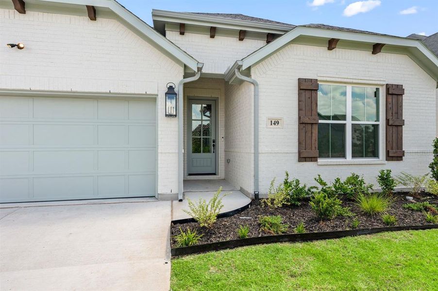 Front exterior of a new home in , Aledo, TX, highlighting curb appeal (Image 24). Front exterior of a new home in , Aledo, TX, highlighting curb appeal (Image 24).