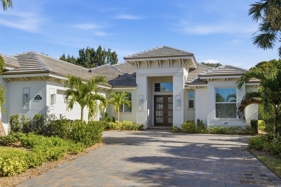 Front exterior of a new home in The Strand, Vero Beach, FL, highlighting curb appeal (Image 29).
