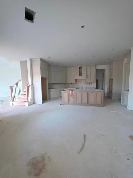 bright, spacious kitchen that immediately feels like the heart of the home.kitchen with abundant cabinets, a large island, and convenient second staircase leading directly to the upstairs gameroom. bright, spacious kitchen that immediately feels like the heart of the home.kitchen with abundant cabinets, a large island, and convenient second staircase leading directly to the upstairs gameroom.