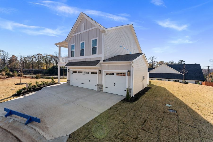 Front exterior of a new home in Lakeside Saluda, Greenville, SC, highlighting curb appeal (Image 17). Front exterior of a new home in Lakeside Saluda, Greenville, SC, highlighting curb appeal (Image 17).