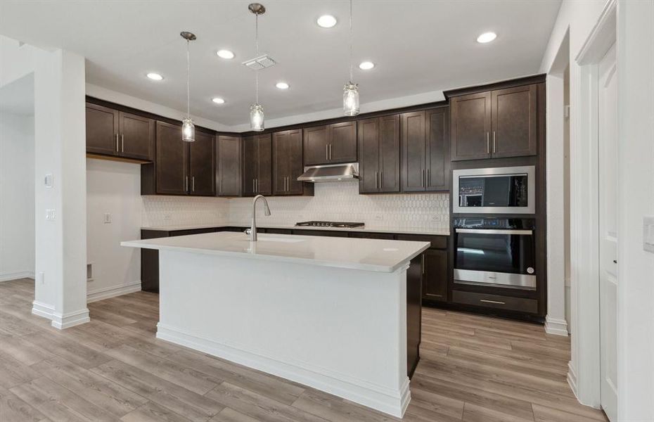 Airy kitchen with ample cabinet space *real home pictured