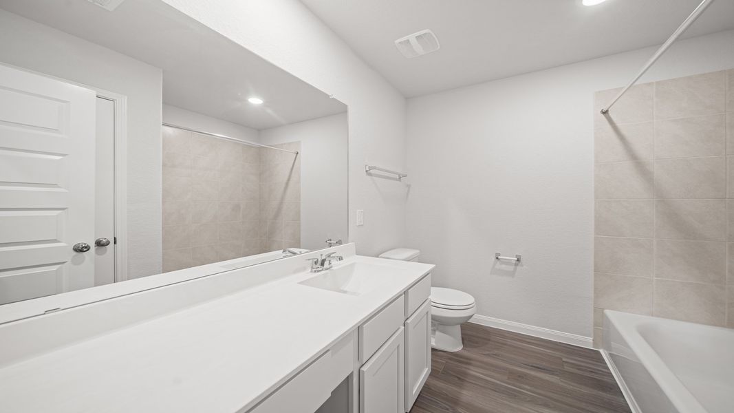 Representative furnished interior of a home built from the The Summit by Legend Homes in Bluestem, Brookshire (Image 11).