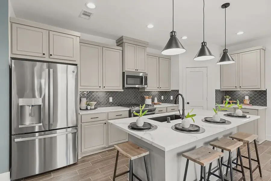 Representative furnished interior of a home built from the Countryside by Chesmar Homes in Meridiana Townhomes, Iowa Colony (Image 7).