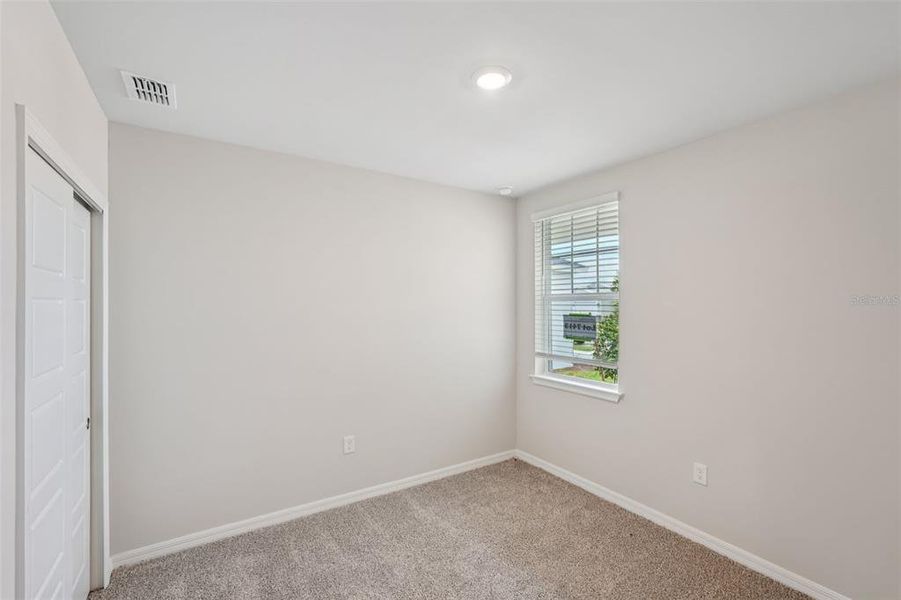 Spacious, unfurnished interior of a new home in Crescent Lakes - Premier Series, Punta Gorda (Image 21).