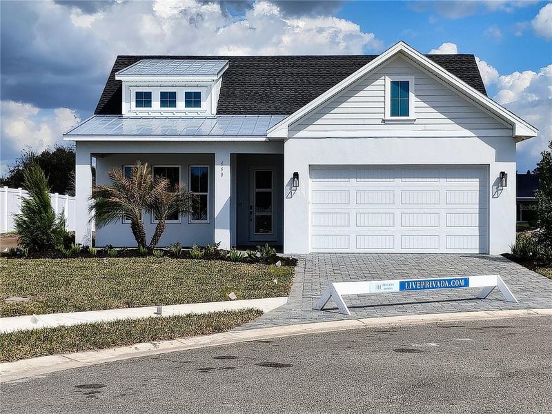 Front exterior of a new home in Gracewater at Sarasota, Sarasota, FL, highlighting curb appeal (Image 1). Front exterior of a new home in Gracewater at Sarasota, Sarasota, FL, highlighting curb appeal (Image 1).