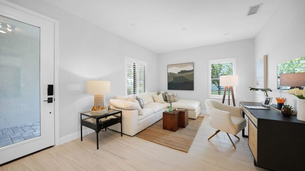 Representative furnished interior of a home built from the Meadow Brook by Neal Communities in SkySail, Naples (Image 5).