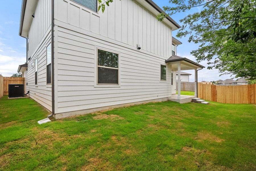 Front exterior of a new home in The Hills of Bear Creek, Manchaca, TX, highlighting curb appeal (Image 39).