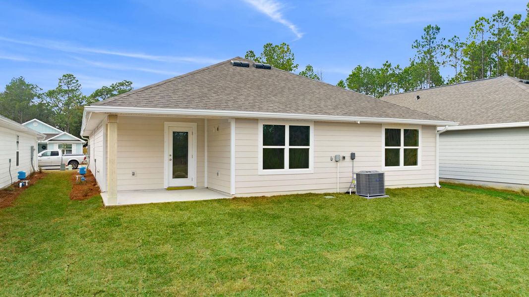 Exterior details and patio area of a home in Ashton Park Phase III, Freeport (Image 4).