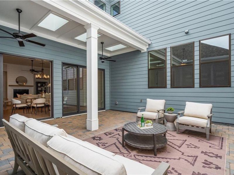 Exterior details and patio area of a home in The Village at Towne Lake, Woodstock (Image 34).