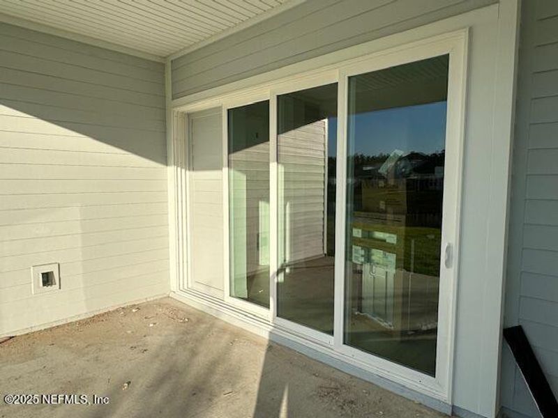 Exterior details and patio area of a home in Holly Landing at SilverLeaf, St. Augustine (Image 2). Exterior details and patio area of a home in Holly Landing at SilverLeaf, St. Augustine (Image 2).